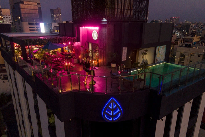 The Sky Yard offers an enchanting rooftop experience with ambient lighting and a modern, chic decor that sets the mood for memorable nights under the stars.